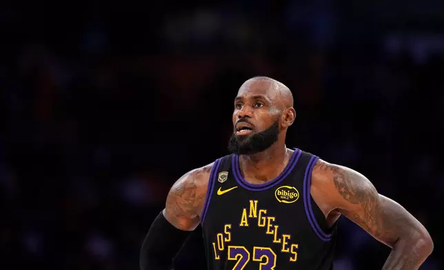 Los Angeles Lakers forward LeBron James stands on the court in the closing minutes of Game 4 in a second-round NBA basketball playoffs series against the Oklahoma City Thunder, Monday, May 11, 2026, in Los Angeles. (AP Photo/Mark J. Terrill)