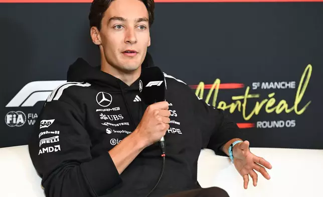 Mercedes driver George Russell of Britain speaks speak during the drivers' press conference at the F1 Canadian Grand Prix auto race in Montreal, Thursday, May 21, 2026. (Graham Hughes/The Canadian Press via AP)