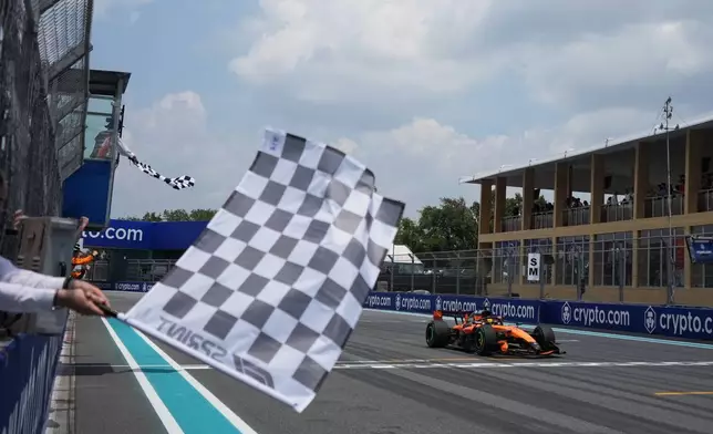 McLaren driver Oscar Piastri of Australia crosses the finish line during a sprint auto race at the Miami Formula One Grand Prix, Saturday, May 2, 2026, in Miami Gardens, Fla. (AP Photo/Rebecca Blackwell, Pool)