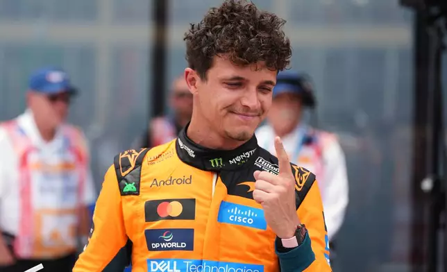 McLaren driver Lando Norris of Britain reacts after winning a sprint auto race at the Miami Formula One Grand Prix, Saturday, May 2, 2026, in Miami Gardens, Fla. (AP Photo/Rebecca Blackwell)