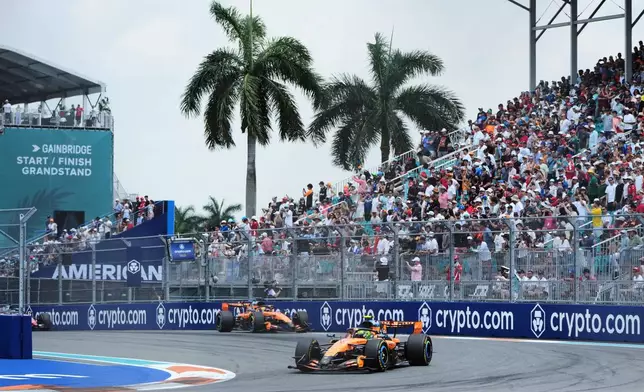 McLaren driver Lando Norris, right, of Britain and McLaren driver Oscar Piastri of Australia steers their cars during a sprint auto race at the Miami Formula One Grand Prix, Saturday, May 2, 2026, in Miami Gardens, Fla. (AP Photo/Lynne Sladky)