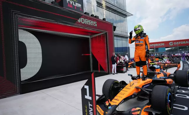 McLaren driver Lando Norris of Britain reacts after winning a sprint auto race at the Miami Formula One Grand Prix, Saturday, May 2, 2026, in Miami Gardens, Fla. (AP Photo/Rebecca Blackwell)