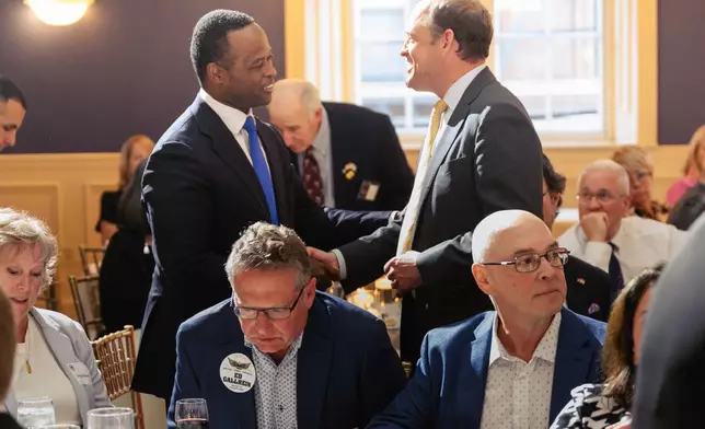 Republican Kentucky candidates for U.S. Senate Daniel Cameron and Andy Barr shake hands during the Kenton County Republican Party Lincoln Day Dinner, Thursday, April 30, 2026, in Covington, Ky. (AP Photo/Jon Cherry)