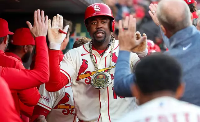 St. Louis Cardinals' Jordan Walker is congratulated by teammates after hitting a two-run home run during the third inning of a baseball game against the Los Angeles Dodgers Saturday, May 2, 2026, in St. Louis. (AP Photo/Scott Kane)