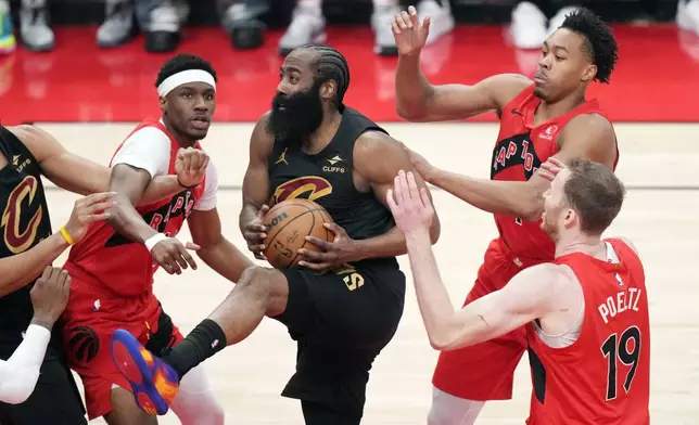 Cleveland Cavaliers' James Harden (1) is surround by Toronto Raptors during the first half of Game 6 in the first round of an NBA basketball playoffs series in Toronto on Friday, May 1, 2026. (Nathan Denette/The Canadian Press via AP)