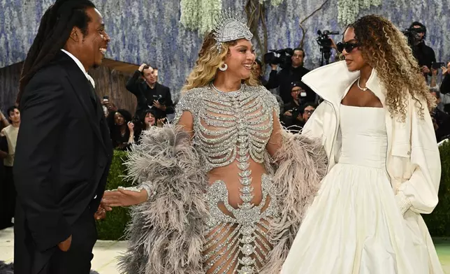 Jay-Z, from left, Beyoncé, and, Blue Ivy Carter arrive at The Metropolitan Museum of Art's Costume Institute benefit gala celebrating the opening of the "Costume Art" exhibition on Monday, May 4, 2026, in New York. (Photo by Evan Agostini/Invision/AP)