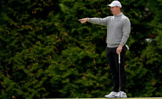 Rory McIlroy, of Northern Ireland, lines up his shot on the 12th green during a PGA Championship golf tournament practice round at Aronimink Golf Club, Wednesday, May 13, 2026, in Newtown Square, PA. (AP Photo/Carolyn Kaster)