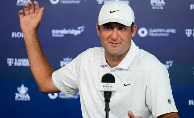 Scottie Scheffler speaks with the media after a PGA Championship golf tournament practice round at Aronimink Golf Club, Tuesday, May 12, 2026, in Newtown Square, PA. (AP Photo/Frank Franklin II)