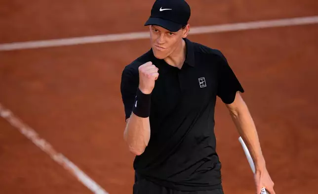 Jannik Sinner, of Italy, celebrates winning a point against Casper Ruud, of Norway, during the final match at the Italian Open tennis tournament, in Rome, Sunday, May 17, 2026. (AP Photo/Alessandra Tarantino)