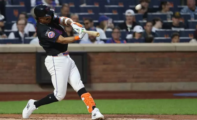 New York Mets' Mark Vientos (27) hits a home run during the third inning of a baseball game against the Miami Marlins Friday, May 29, 2026, in New York. (AP Photo/Pamela Smith)