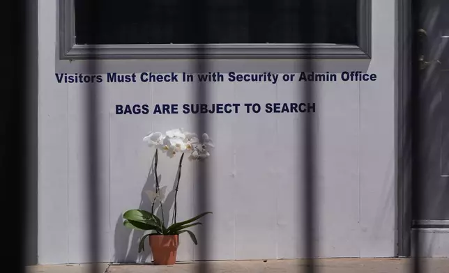 Orchids are left outside of the Islamic Center of San Diego, the day after a shooting, Tuesday, May 19, 2026, in San Diego. (AP Photo/Jae C. Hong)