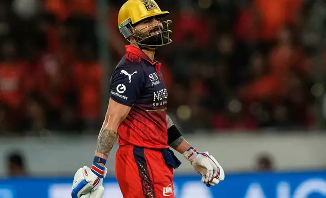 Royal Challengers Bengaluru's Virat Kohli leaves the ground after losing his wicket during the Indian Premier League cricket match between Sunrisers Hyderabad and Royal Challengers Bengaluru in Hyderabad, India, Friday, May 22, 2026. (AP Photo/Mahesh Kumar A.)