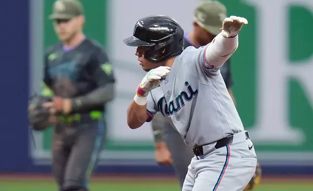 Miami Marlins' Javier Sanoja celebrates his RBI double off Tampa Bay Rays pitcher Bryan Baker during the ninth inning of a baseball game Saturday, May 16, 2026, in St. Petersburg, Fla. (AP Photo/Chris O'Meara)