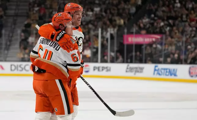 Anaheim Ducks center Mikael Granlund (64) celebrates after scoring against the Vegas Golden Knights during the third period of Game 1 of a second-round NHL hockey Stanley Cup playoff series Monday, May 4, 2026, in Las Vegas. (AP Photo/John Locher)
