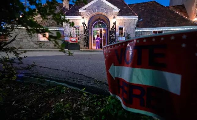 A sign directs voters arriving to vote in the Georgia primary elections on Tuesday, May 19, 2026, in Atlanta. (AP Photo/Brynn Anderson)
