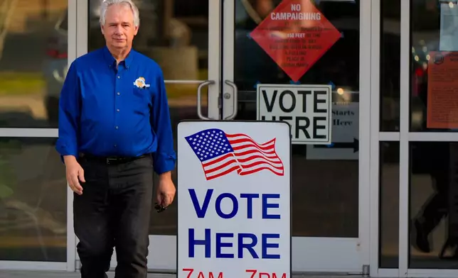 Richard Cullom leaves a voting center after voting, Tuesday, May 19, 2026, in Marietta, Ga. (AP Photo/Mike Stewart)