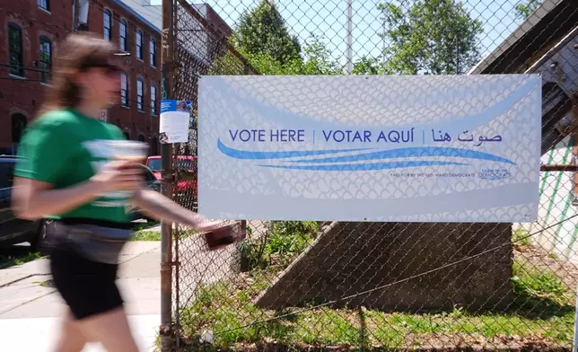 A person walks outside a polling place in Philadelphia, Tuesday, May 19, 2026. (AP Photo/Matt Rourke)