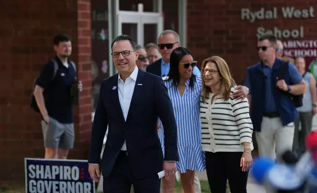 Pennsylvania Gov. Josh Shapiro walk to speaks with members of the media outside his polling place in Rydal, Pa., Tuesday, May 19, 2026. (AP Photo/Matt Rourke)