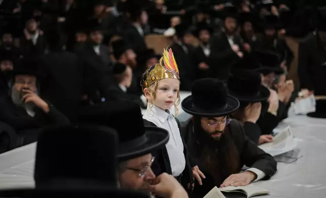 Ultra-Orthodox Jews celebrate the holiday of Lag BaOmer, traditionally marked by bonfire, music, and communal celebrations, in Netanya, Israel, Monday, May 4, 2026. (AP Photo/Ariel Schalit)