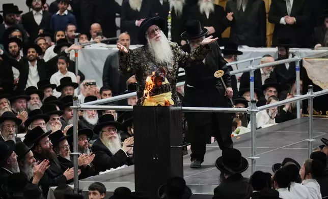 Ultra-Orthodox Jews celebrate the holiday of Lag BaOmer, traditionally marked by bonfire, music, and communal celebrations, in Netanya, Israel, Monday, May 4, 2026. (AP Photo/Ariel Schalit)