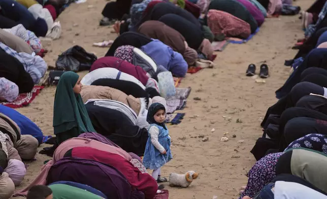 Muslims worshipers offer Eid al-Adha prayers in Gaza City Wednesday, May 27, 2026. (AP Photo/Jehad Alshrafi)