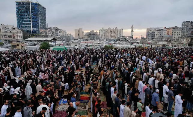 Muslims worshipers gather for Eid al-Adha prayers in Gaza City Wednesday, May 27, 2026. (AP Photo/Jehad Alshrafi)