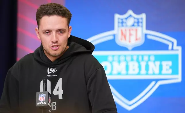 FILE - Miami quarterback Carson Beck speaks during a news conference at the NFL football scouting combine in Indianapolis, Friday, Feb. 27, 2026. (AP Photo/Julio Cortez, File)