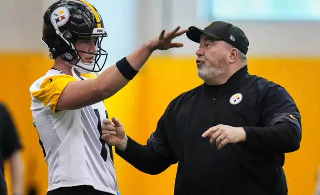 Pittsburgh Steelers head coach Mike McCarthy, right, gives instructions to quarterback Drew Allar during the football team's Rookie Minicamp workout in Pittsburgh, Saturday, May 9, 2026. (AP Photo/Gene J. Puskar)