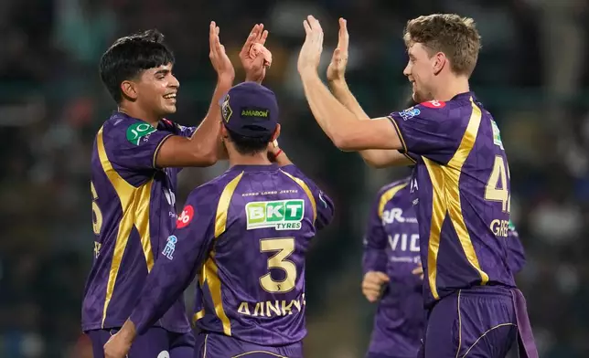 Kolkata Knight Riders' Kartik Tyagi, left, celebrates with teammates the wicket of Delhi Capitals' KL Rahul during the Indian Premier League cricket match between Delhi Capitals and Kolkata Knight Riders in New Delhi, India, Friday, May 8, 2026. (AP Photo/Manish Swarup)