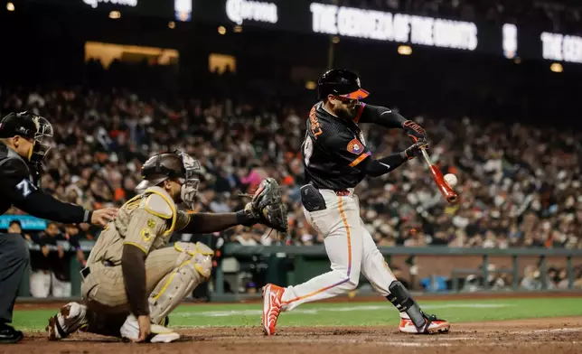 San Francisco Giants' Jesus Rodriguez (79) hits his first MLB home run in the seventh inning of a baseball game against the San Diego Padres in San Francisco on Tuesday, May 5, 2026. (Carlos Avila Gonzalez/San Francisco Chronicle via AP)