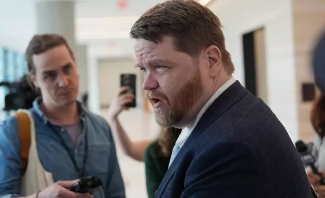 Mark Bankston, an attorney for relatives of the victims of the 2012 Sandy Hook School shooting, speaks to the media following a hearing at the county courthouse in Austin, Texas, Thursday, April 30, 2026. (AP Photo/Eric Gay)