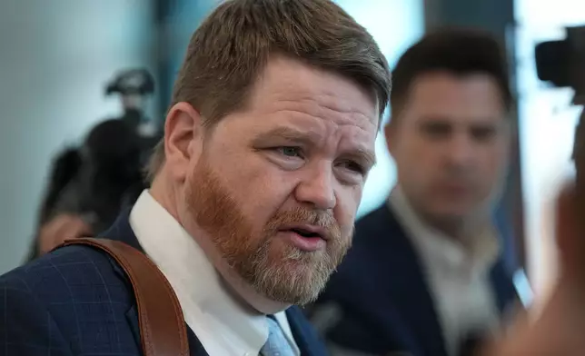Mark Bankston, an attorney for relatives of the victims of the 2012 Sandy Hook School shooting, speaks to the media following a hearing at the county courthouse in Austin, Texas, Thursday, April 30, 2026. (AP Photo/Eric Gay)