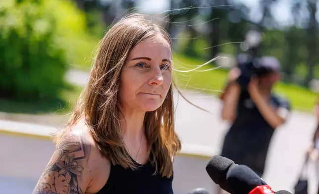 Kim Prosser speask to the media outside the Ontario Court of Justice, Friday, May 29, 2026, in Newmarket, Ontario, after Kenneth Law pleaded guilty to 14 counts of counseling or aiding suicide, including the death of Prosser's son Ashtyn. (Christopher Drost/The Canadian Press via AP)