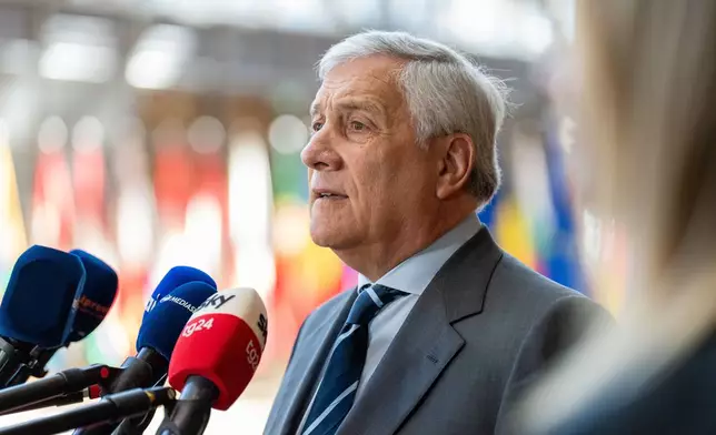 Italy's Foreign Minister Antonio Tajani speaks with the media as he arrives for a meeting of EU foreign ministers at the European Council building in Brussels, Monday, May 11, 2026. (AP Photo/Marius Burgelman)