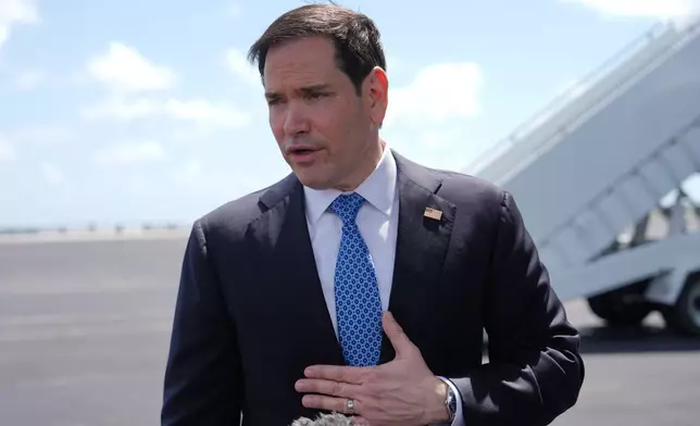 Secretary of State Marco Rubio speaks to the press before boarding his plane at Homestead Air Reserve Base, Thursday, May 21, 2026. Rubio is traveling to a NATO foreign ministers meeting in Sweden. (AP Photo/Julia Demaree Nikhinson, Pool)