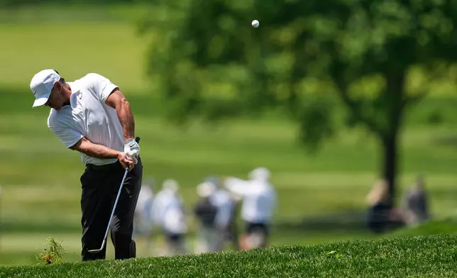 Brooks Koepka chips to the green on the sixth hole during the first round of the PGA Championship golf tournament practice round at Aronimink Golf Club, Thursday, May 14, 2026, in Newtown Square, PA. (AP Photo/Matt Slocum)