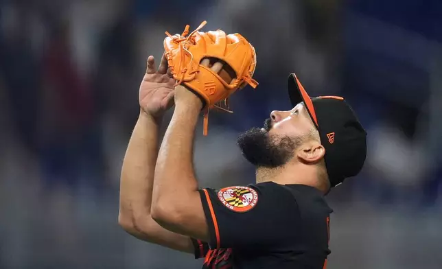 Baltimore Orioles closing pitcher Rico Garcia reacts after holding off the Miami Marlins for the win, in a baseball game, Tuesday, May 5, 2026, in Miami. (AP Photo/Rebecca Blackwell)