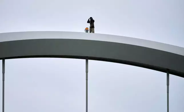 Guido Reichstadter, 45, is seen on top of the Frederick Douglass Bridge, Wednesday, May 6, 2026 in Washington. Reichstadter has come down, after his 6-day protest. (AP Photo/Julia Demaree-Nikhinson)