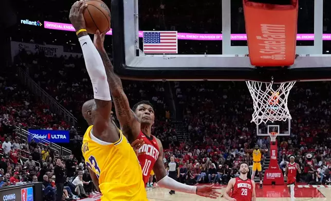 Houston Rockets forward Jabari Smith Jr. (10) blocks a shot by Los Angeles Lakers forward LeBron James (23) during the second half of Game 6 of a first-round NBA playoffs basketball series in Houston, Friday, May 1, 2026. (AP Photo/Ashley Landis)