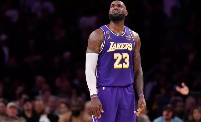 Los Angeles Lakers forward LeBron James looks toward the scoreboard during the second half in Game 5 of a first-round NBA playoffs basketball series against the Houston Rockets, Wednesday, April 29, 2026, in Los Angeles. (AP Photo/Mark J. Terrill)