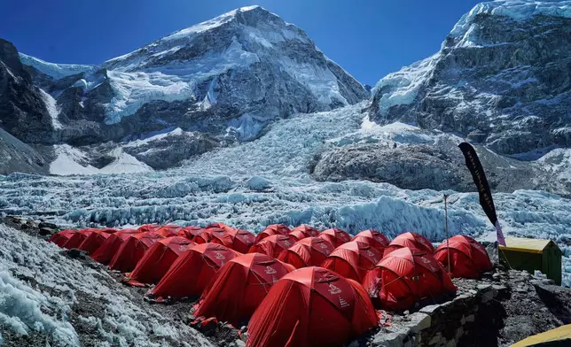 FILE - Khumbu Icefall is visible between two peaks in the background at the Everest Base Camp in Nepal, April 25, 2025. (AP Photo/Pasang Rinzee Sherpa, File)