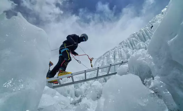 FILE - A mountaineer takes part in a training session at Khumbu Icefall before beginning his ascent to the summit of Mount Everest in Nepal, April 27, 2025. (AP Photo/Pasang Rinzee Sherpa, File)
