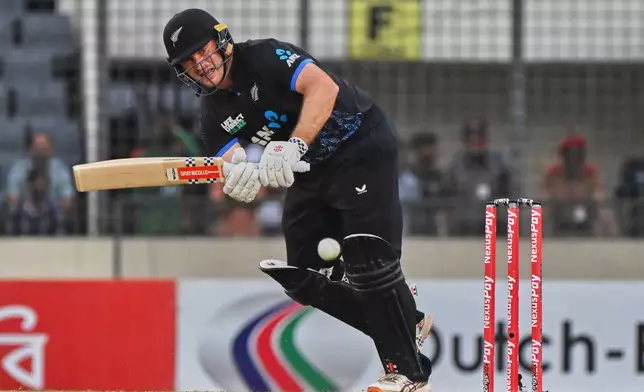 New Zealand's Dean Foxcroft plays a shot during the third T20 international cricket match between Bangladesh and New Zealand in Mirpur, Bangladesh, Saturday, May 2, 2026. (AP Photo/Mosaraf Hossain)