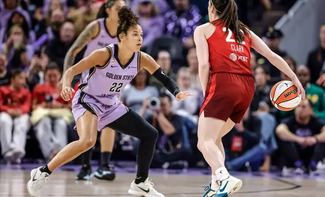 Indiana Fevers' Caitlin Clark (22) drives to the basket against Golden State Valkyries' Veronica Burton (22) during the first half of a WNBA basketball game in San Francisco on Thursday, May 28, 2026. (Carlos Avila Gonzalez/San Francisco Chronicle via AP)