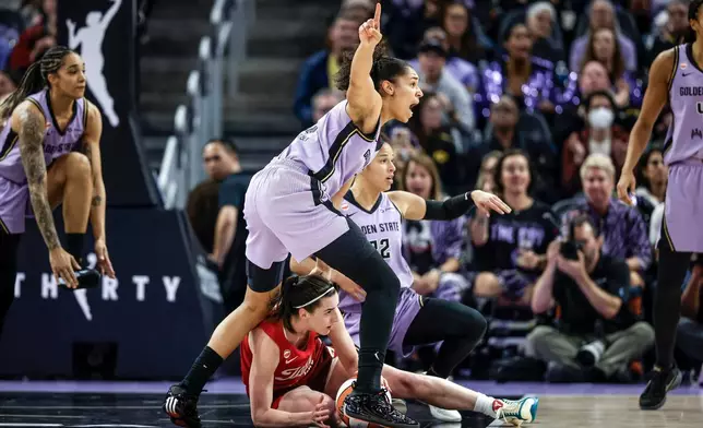 Golden State Valkyries' Janelle Salaün (13) points out a turnover to the referees by Indiana Fevers' Caitlin Clark (22) during the first half of a WNBA basketball game in San Francisco on Thursday, May 28, 2026. (Carlos Avila Gonzalez/San Francisco Chronicle via AP)