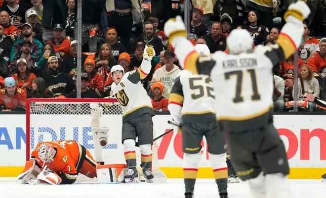 Vegas Golden Knights right wing Mitch Marner, second from right, celebrates after scoring on Anaheim Ducks goaltender Lukas Dostal, left, during the first period in Game 6 of a second-round NHL hockey Stanley Cup playoff series Thursday, May 14, 2026, in Anaheim, Calif. (AP Photo/Mark J. Terrill)