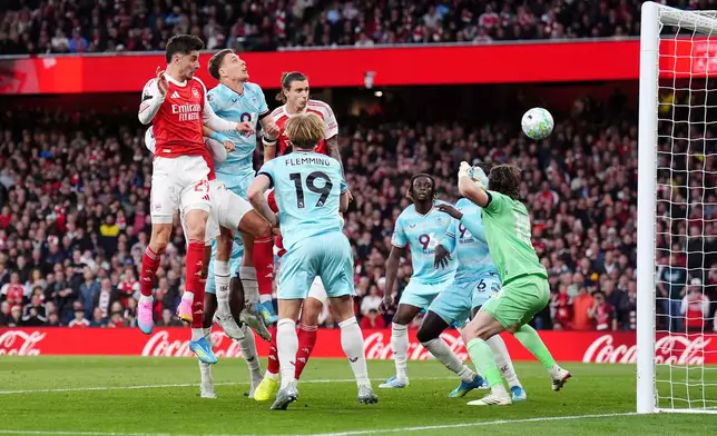 Arsenal's Kai Havertz, left, scores their side's first goal during the English Premier League soccer match between Arsenal and Burnley in London, Monday May 18, 2026. (John Walton/PA via AP)