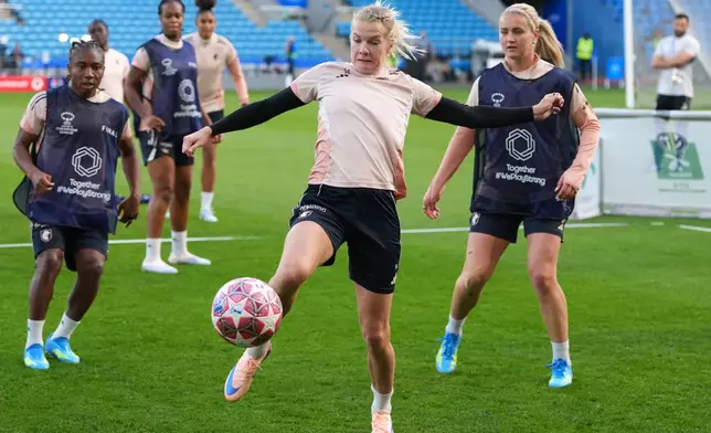 Lyonnes' Ada Hegerberg reaches for the ball during a training session on the eve of the Women's Champions League final soccer match between FC Barcelona and OL Lyonnes, in Oslo, Friday, May 22, 2026. (AP Photo/Kirsty Wigglesworth)