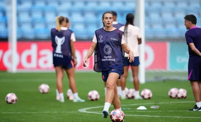 Barcelona's Alexia Putellas walks with a ball during a training session on the eve of the Women's Champions League final soccer match between FC Barcelona and OL Lyonnes, in Oslo, Friday, May 22, 2026. (AP Photo/Kirsty Wigglesworth)