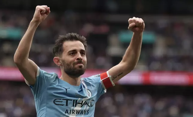 Manchester City's Bernardo Silva celebrates after Manchester City's Antoine Semenyo scoring the opening goal during the English FA Cup final soccer match between Chelsea and Manchester City in London, Saturday, May 16, 2026. (AP Photo/Richard Pelham)